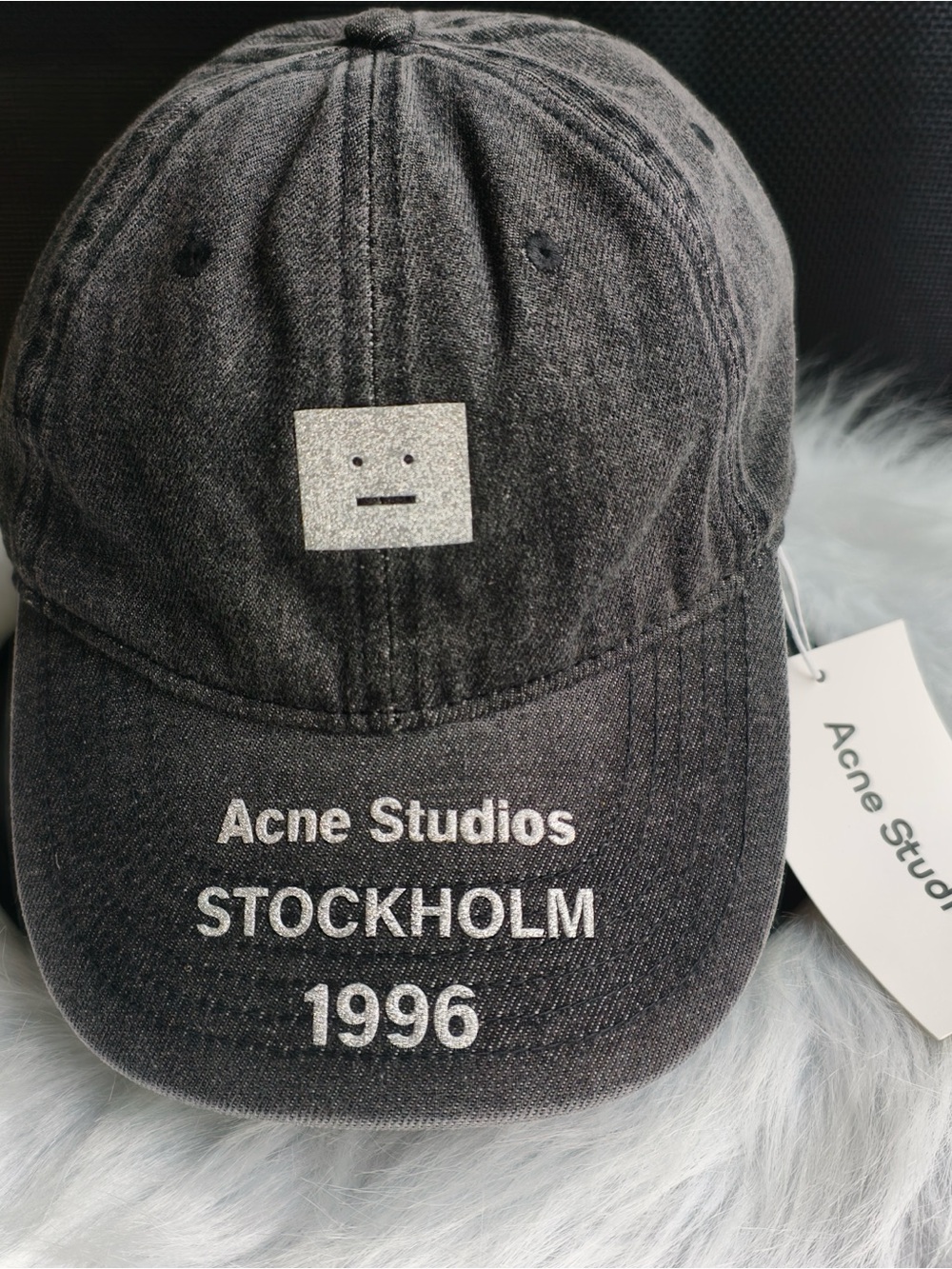 Acne black denim cap with white logo and text